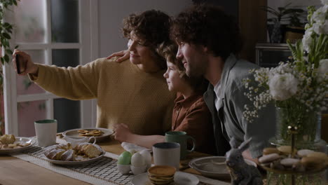 family taking a selfie during easter brunch