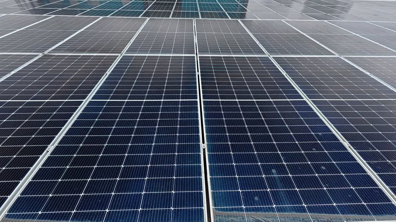 Rows of solar panels installed on a rooftop absorb sunlight, converting it into clean electricity. This sustainable energy source promotes environmental efficiency and supports green living.