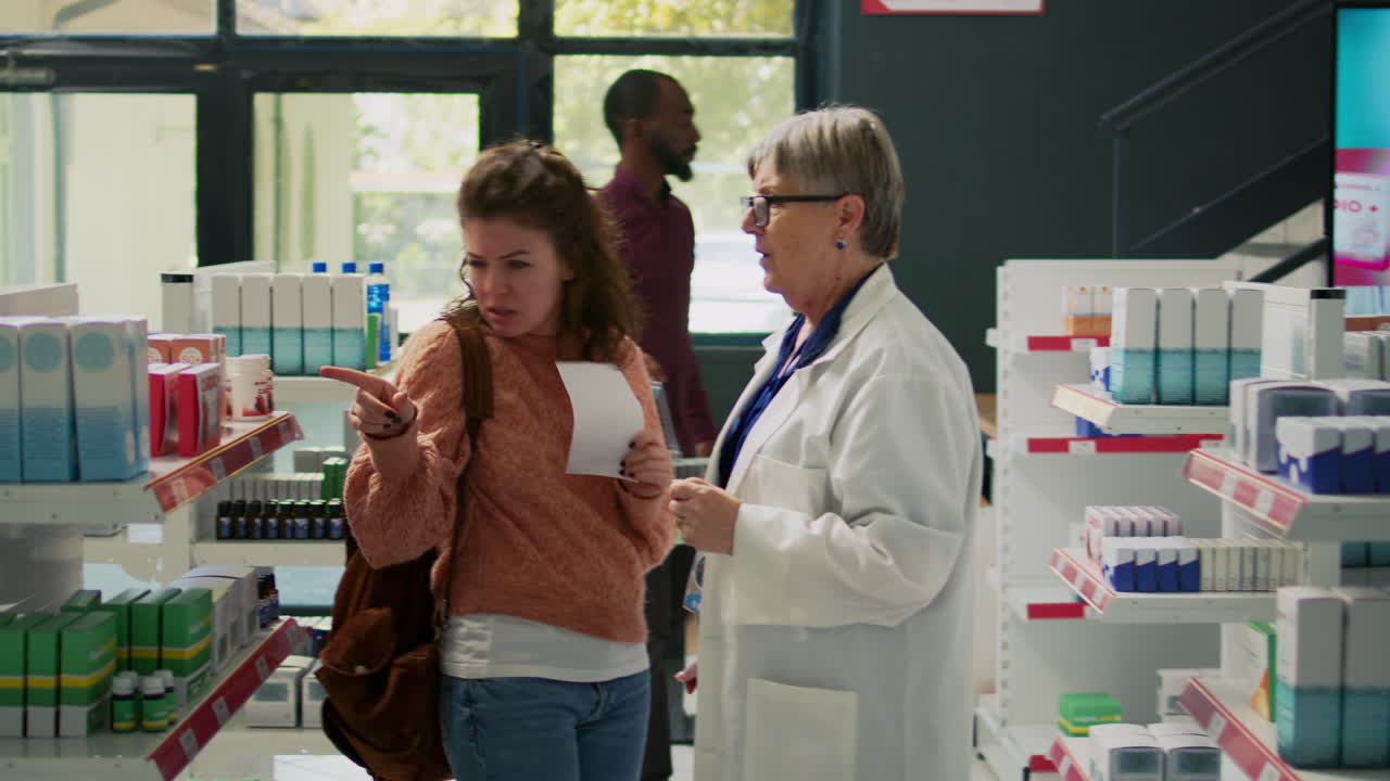 Customers with Pharmacist Inside Drugstore