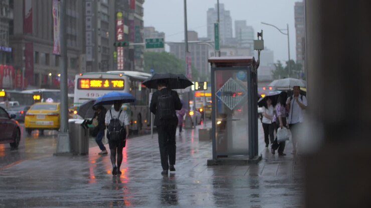 Commuters Walking Through Rainy Streets Taipei