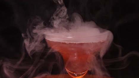 shot of red wine with the smoke into the glass.