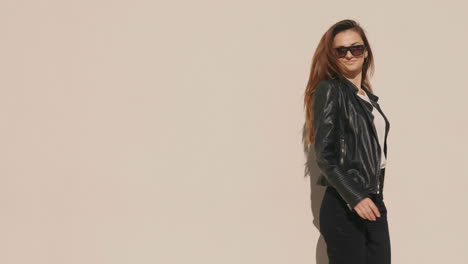 woman in leather jacket and sunglasses