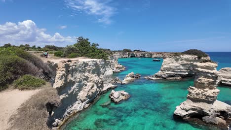 Torre-Sant'Andrea-Limestone-Formations-Surrounded-by-Turquoise-Water-in-Melendugno,-Lecce,-Italy,-Europe