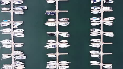 aerial birds-eye drone shot of boats docked in st kilda harbour