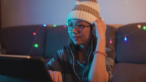 asian woman listening to music