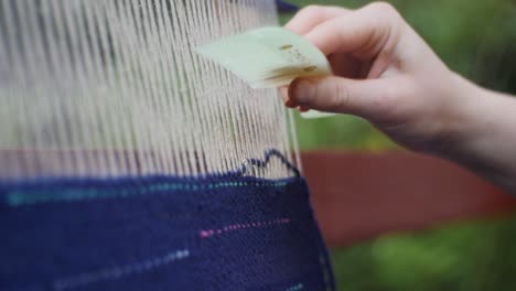 weaving on a large loom - close up