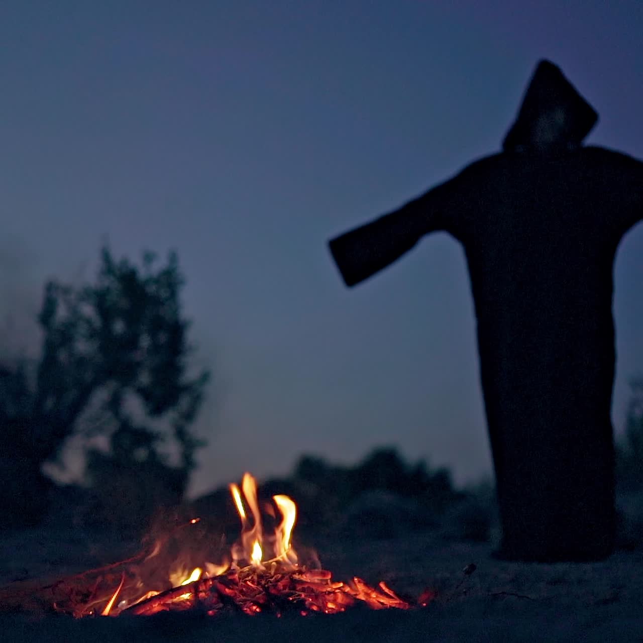 Scary figure in black mantle