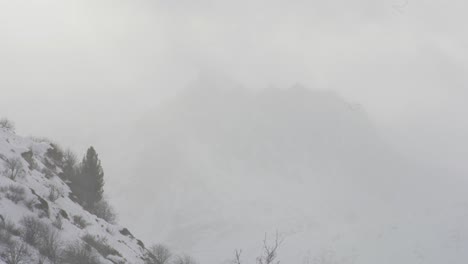 timelapse of a winterstorm engulfing the peak of piz badus in clouds