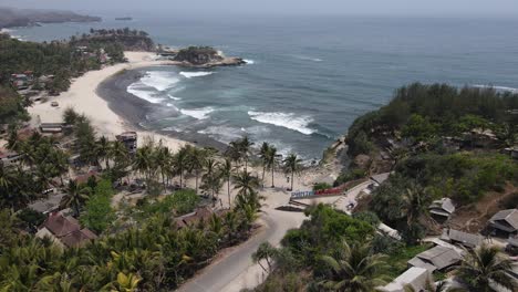 aerial-view-of-Klayar-Beach-which-has-the-charm-of-white-sand-and-beautiful-white-coral-in-Pacitan,-Indonesia