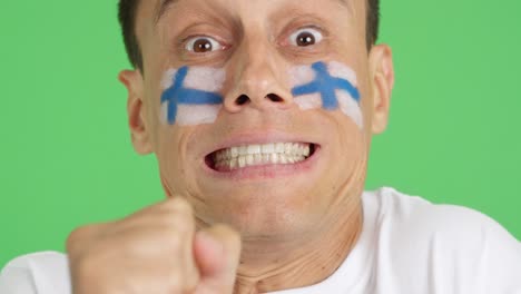 very nervous man supporting finnish team during a difficult match