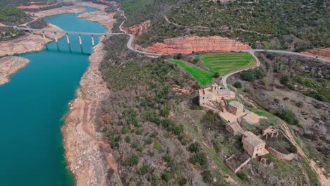 Perched-Rialb-tower-as-seen-from-flying-drone,-Lleida-in-Spain