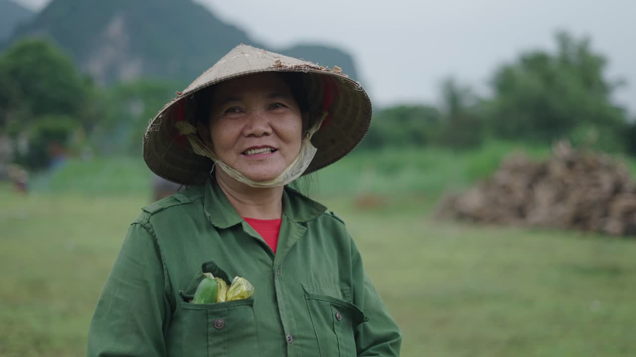 Smiling Vietnamese Farmer in Field