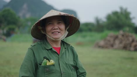 smiling vietnamese farmer in field