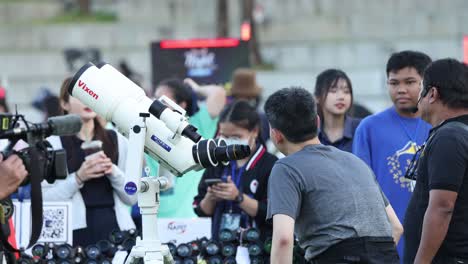 group of photographers taking pictures at an outdoor event