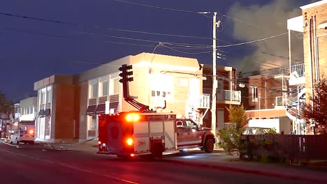 firefighters battle blaze at night