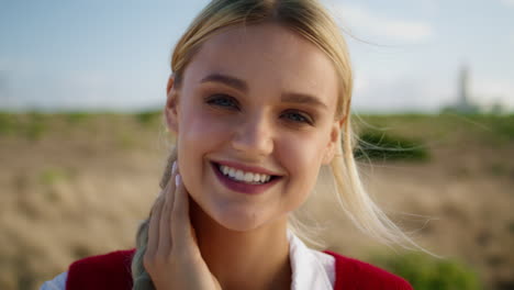 gorgeous lady resting field portrait. smiling model looking camera seductively