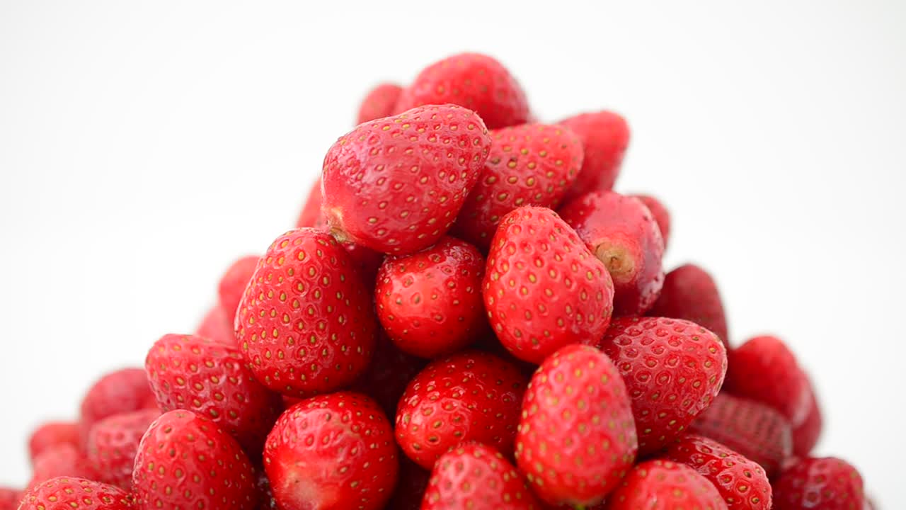 Strawberry on a white background, isolate. Shooting in the movement