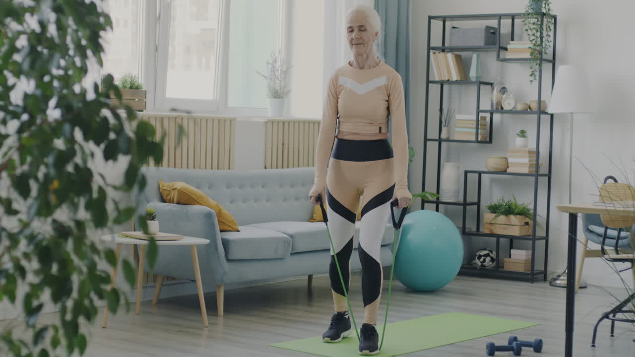 Senior Woman Doing Resistance Band Exercises at Home