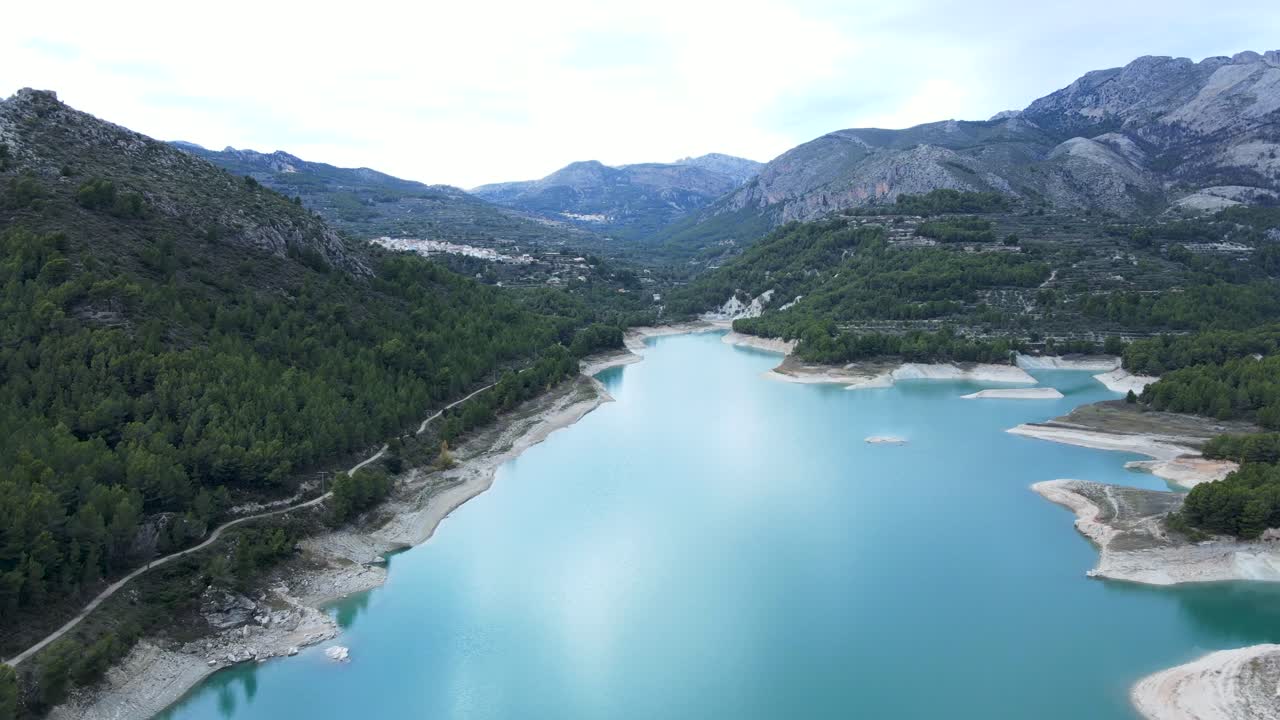 Aerial view of a picturesque lake nestled in a mountain valley