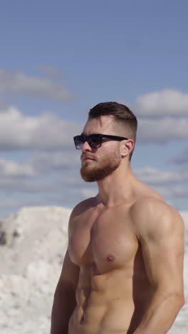 attractive young muscle man outdoors. muscular athletic bodybuilder man posing outdoor
