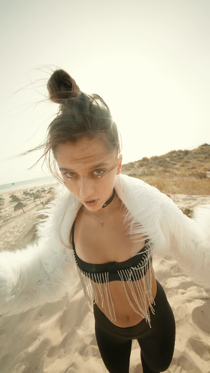 Woman in Fur Coat on Beach