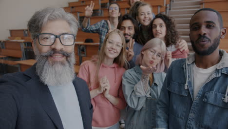 happy students and teacher in a classroom