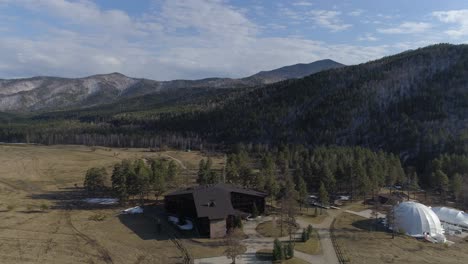 aerial view of a cabin in the mountains