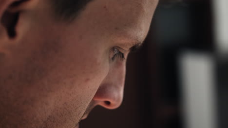 closeup of face of man, prison inmate in prison cell