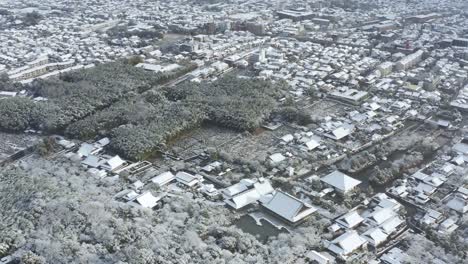 arashiyama kyoto, aerial pan over japan neighborhood and bamboo forest