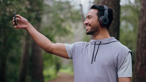 Phone,-exercise-and-man-in-forest-selfie-record