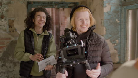 production worker and cameraman closely recording a girlâ€šã„ã´s face during a scene in a ruined building 1