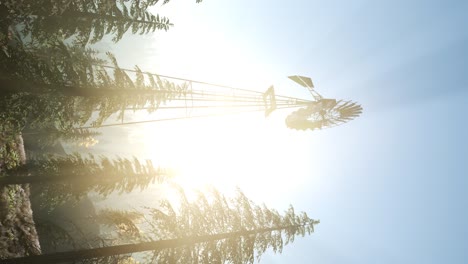 Typical-Old-Windmill-turbine-in-forest.-vertical-format