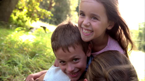 young couple and kids having fun together outdoors