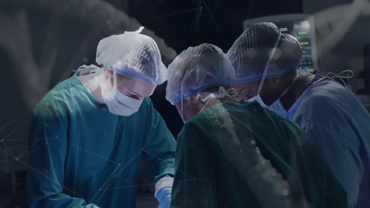 Performing surgery in operating room, surgeons using digital animation overlay