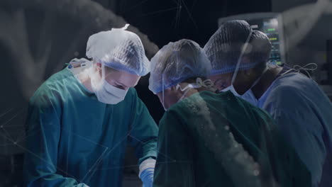 performing surgery in operating room, surgeons using digital animation overlay