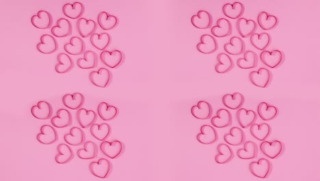 corazones rojos decoración romántica de amor en tema rosa pastel. detenga el movimiento