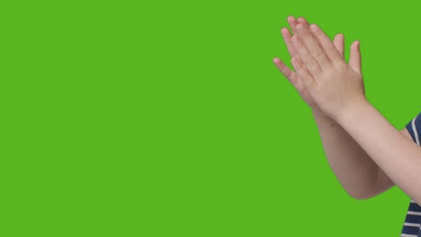 Close-Up-Of-Young-Girl-Clapping-Against-Green-Screen