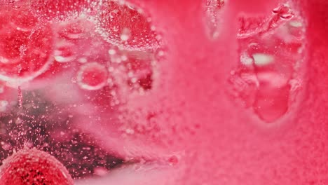 macro-shot-of-red-substance-in-water-slowly-dripping-to-ground-with-red-background