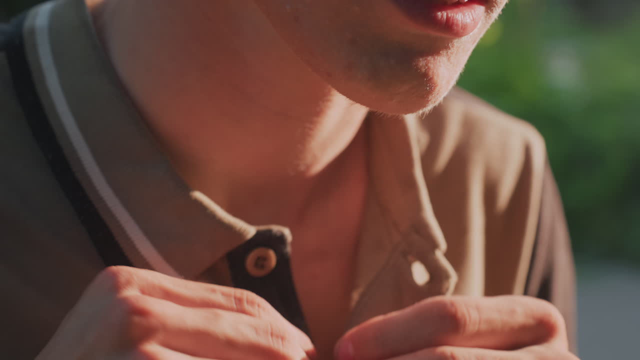 White Man Macro View Of Hands Fastening Collar Button, Extreme Close Focus On Fingers And Fabric Under Warm Light, Repeated Pressing Gestures Convey Fixation, Nervous Energy And Compulsive Attention