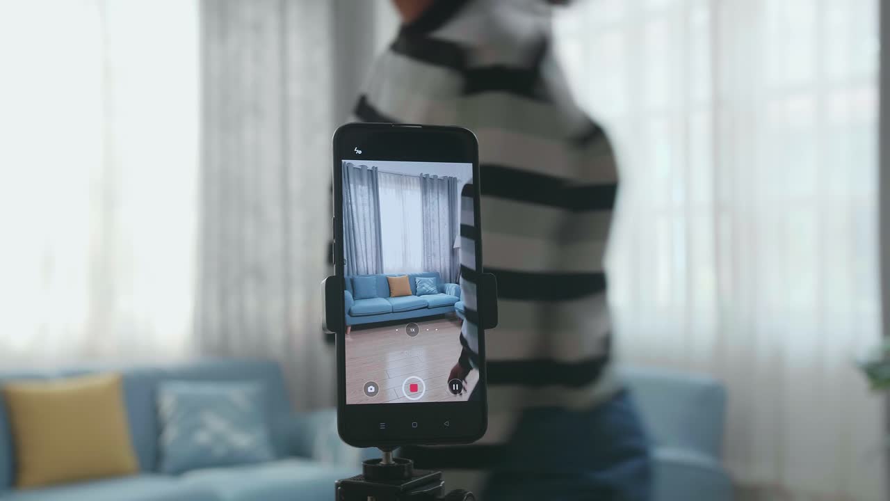 Display Smartphone Of Asian Woman Dancing While Shooting Video Content For Social Networks