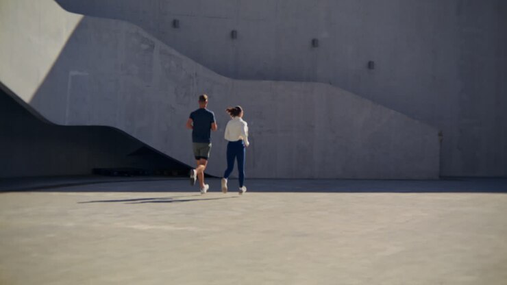 Couple running outdoors