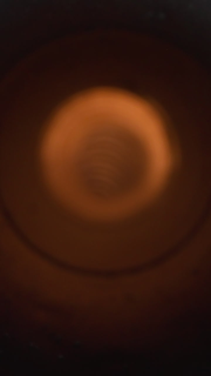 Motion into vacuum cleaner corrugated hose extreme closeup. Housekeeping appliance detail. Contemporary cleaning device for cleaning routine
