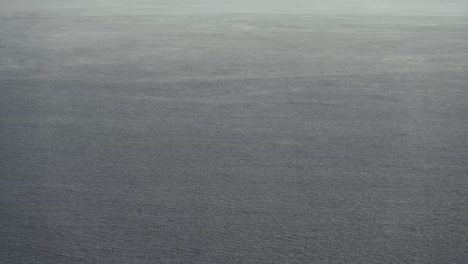 the fine pattern on the water and raindrops during the windy and rainy day