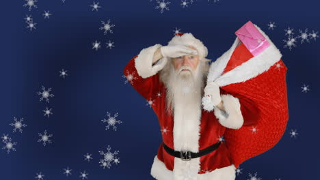 animación de santa claus llevando una bolsa con regalos, nieve cayendo sobre un fondo azul