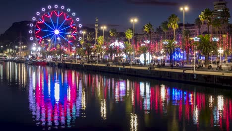 cityscape with reflections in the water of the port of barcelona,catalonia,spain.