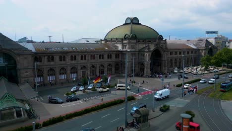 4k aerial drone video of auto traffic in front of the hauptbahnhof train station in downtown nurnberg, germany