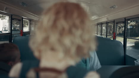 teen school children boarding on empty shuttle. pupils taking seats in transport