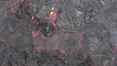 fume rising from red lava on volcanic eruption at fagradalsfjall in reykjanes peninsula, reykjavik iceland