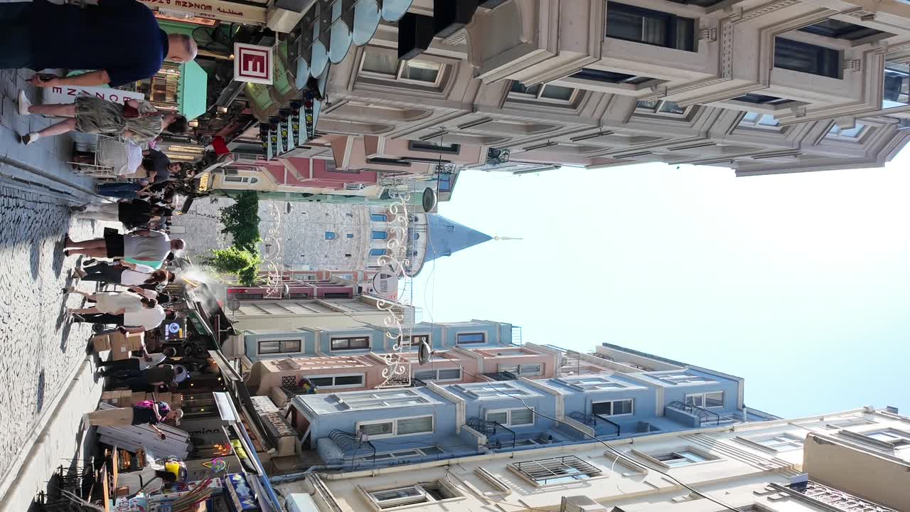 Vibrant City Street Scene with Colorful Buildings and Pedestrians