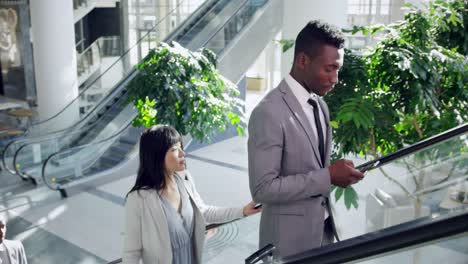 business people using escalator in a modern office 4k